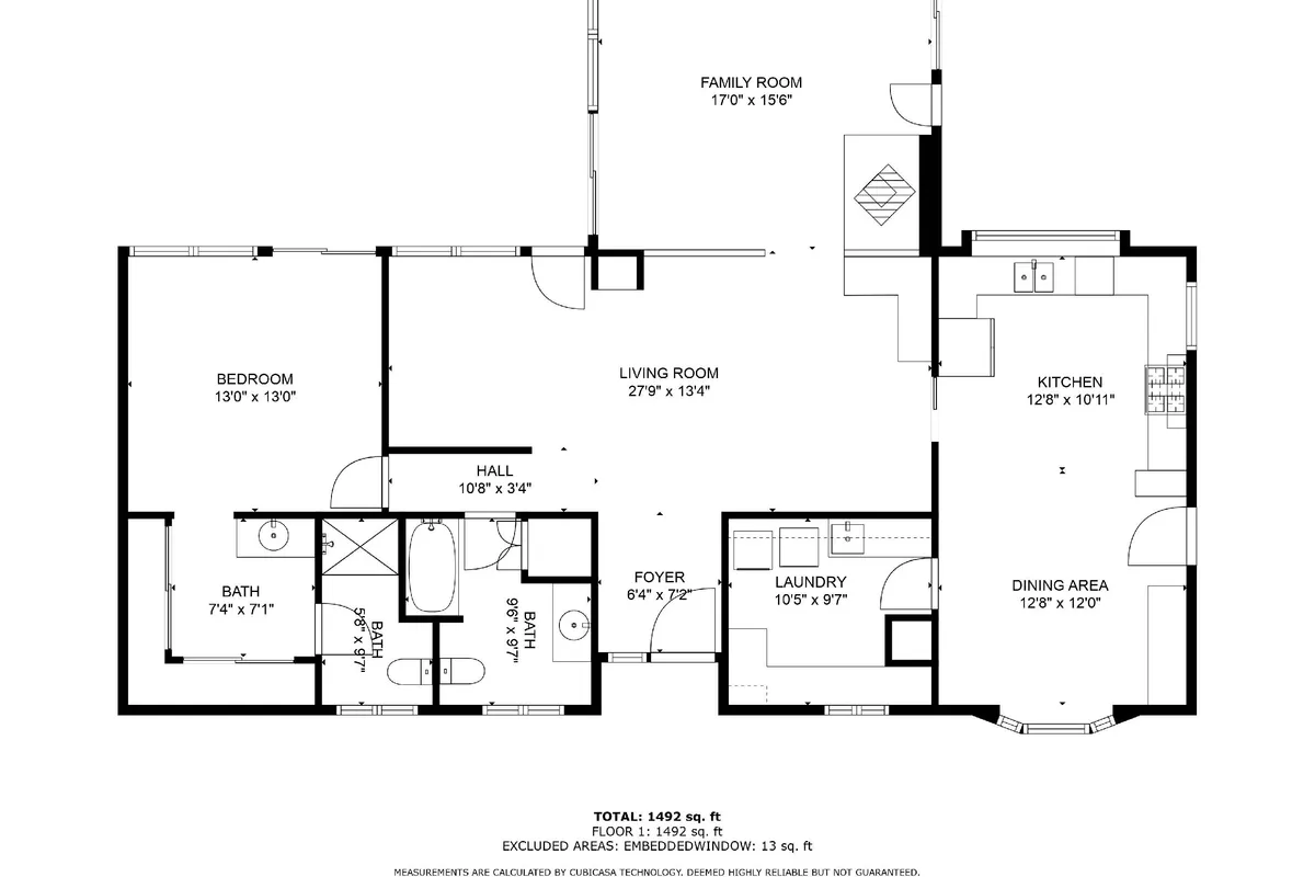 An open-plan living space seamlessly connects the living room, kitchen, dining area, and bedroom. The setup highlights communal areas ideal for group activities like game nights, cooking, and social gatherings.